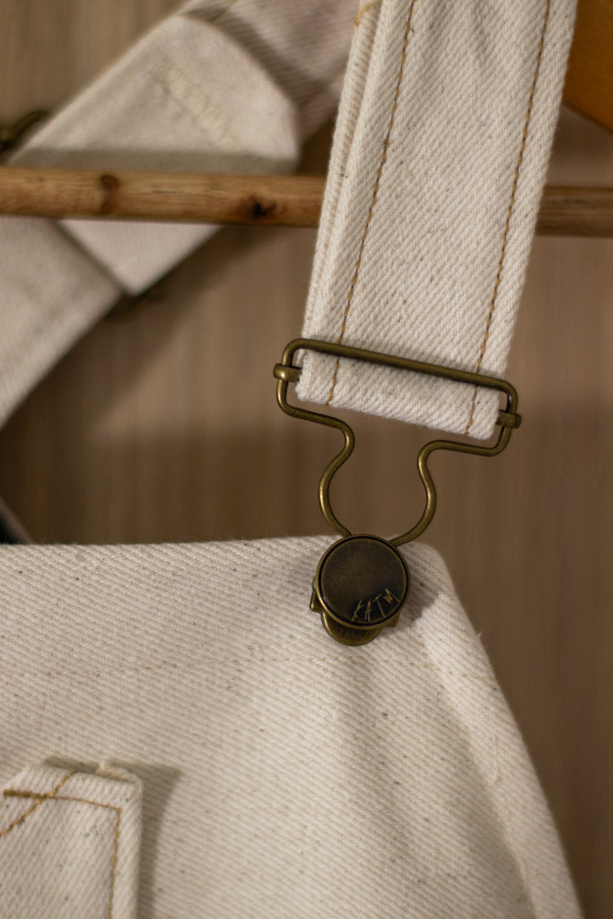 Close up of the yoke overalls / dungarees kylie and the machine hardware buckles.
